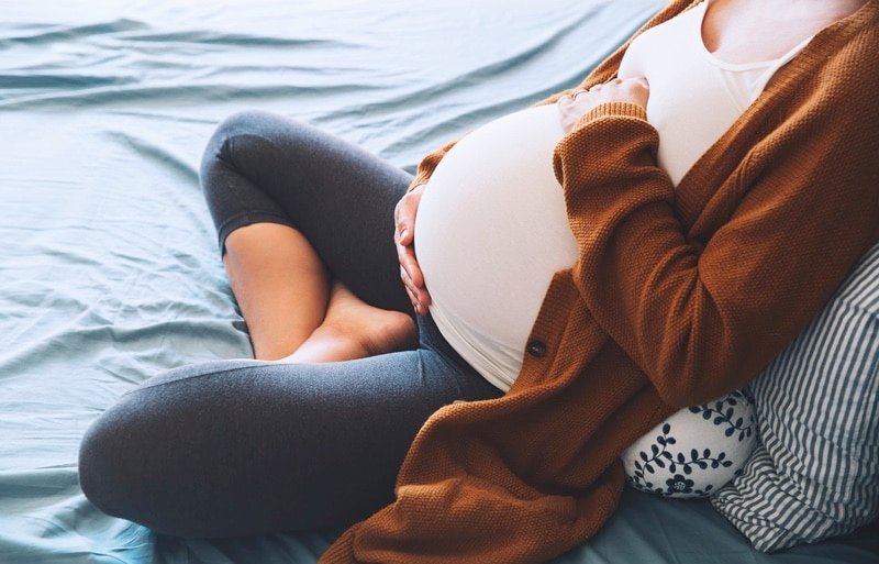 pregnant woman on the couch.