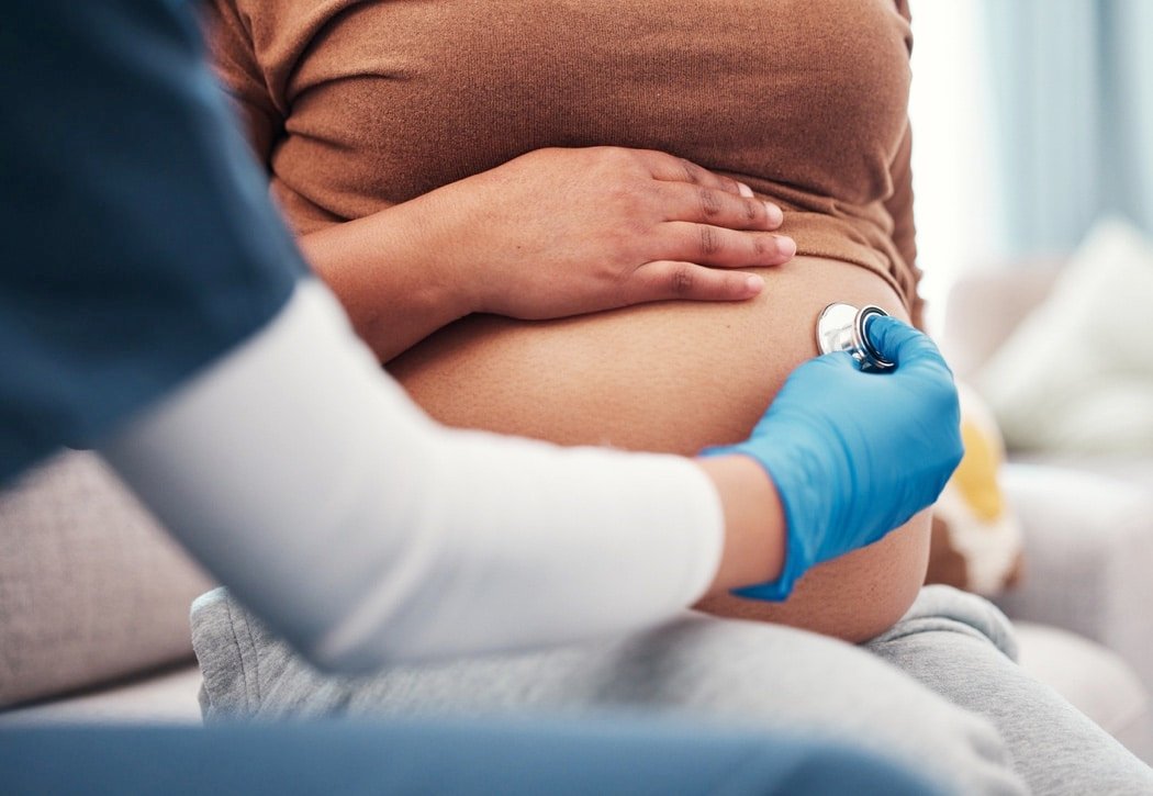 pregnant and woman with healthcare checkup